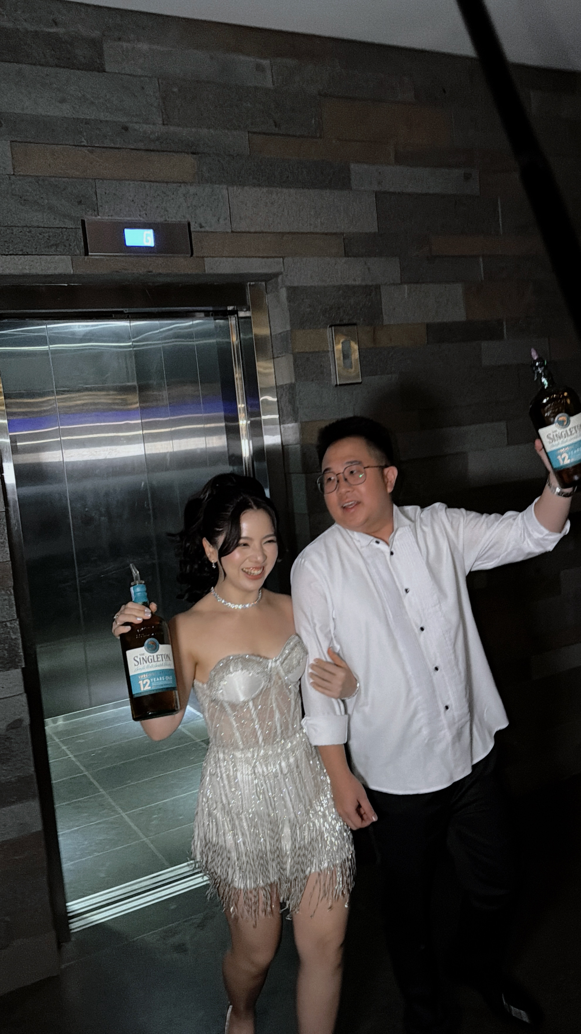 Couple sharing a candid celebratory toast